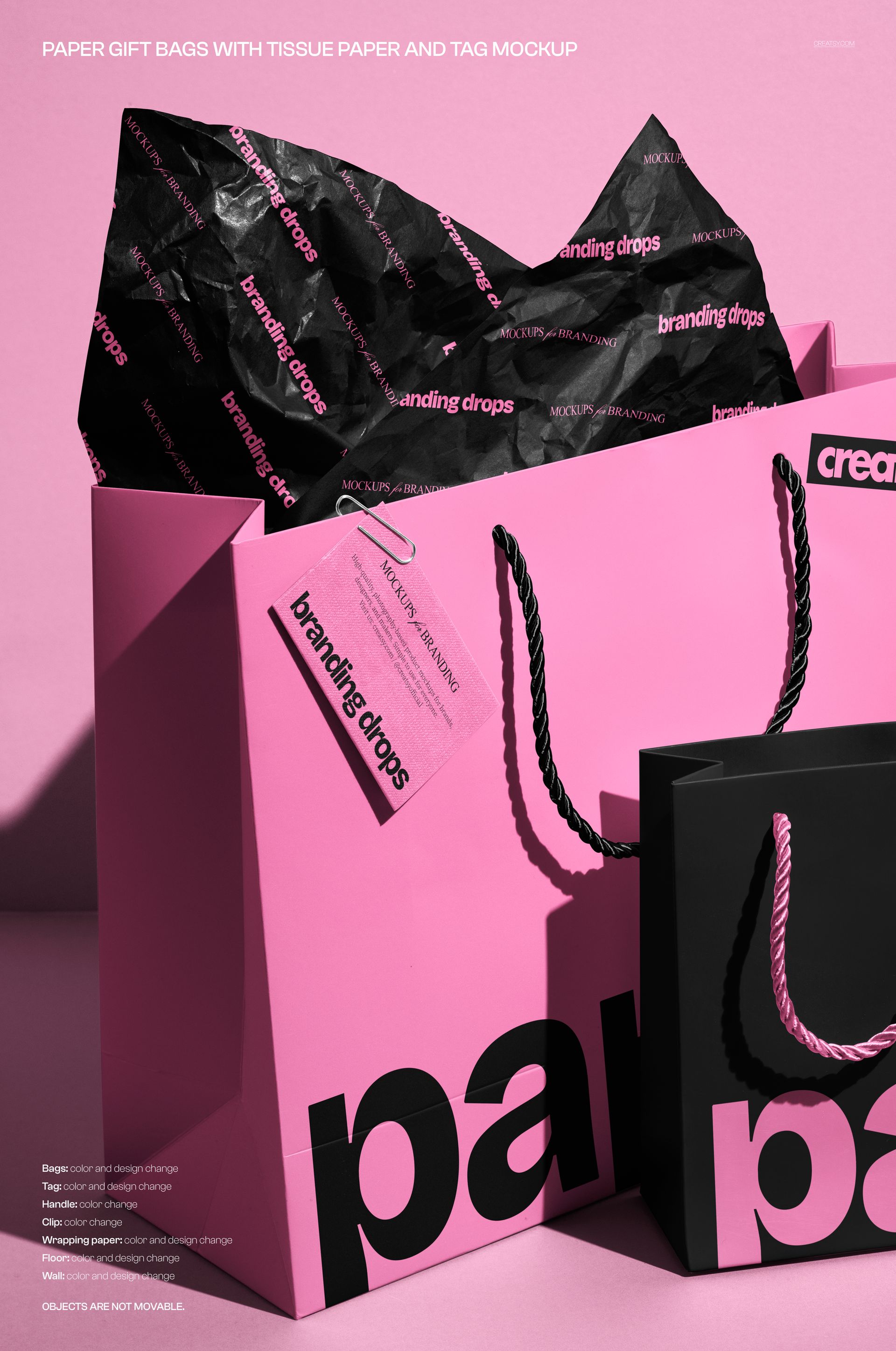 Front view of two paper gift bags, one pink and one black, with rope handles and branded tissue paper inside.