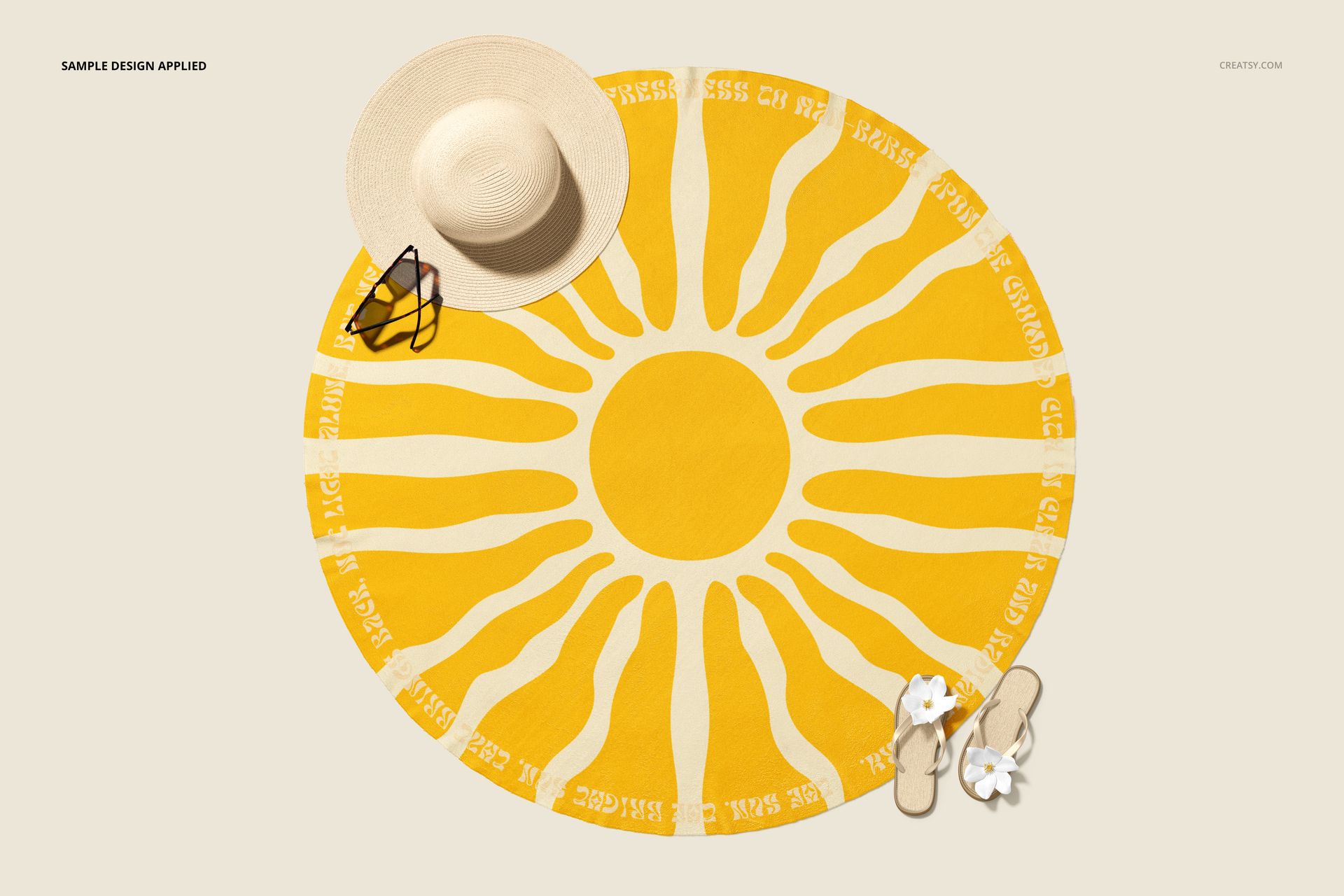 Microfiber round beach towel mockup featuring a yellow sun design, shown from above with summer accessories nearby.