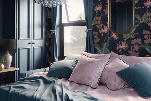 PSD mockup of a stylish bedroom with botanical wallpaper, blue curtains, and neatly arranged pillows and bedding.