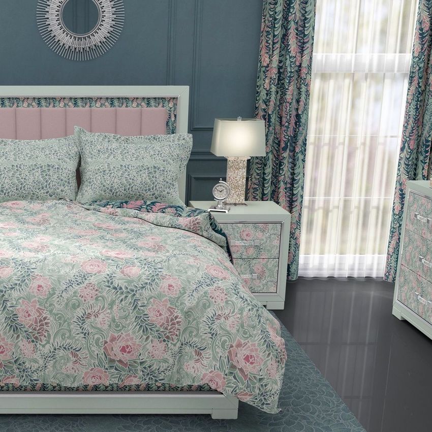 Luxury bedroom bedding mockup featuring a bed with flanged pillows, floral patterned comforter, and matching curtains.