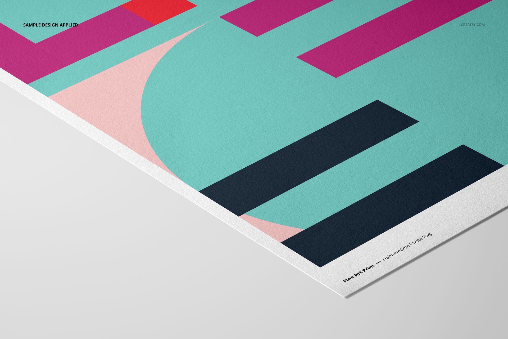A3 fine art print mockup featuring geometric shapes in teal, pink, red, and navy on textured paper, angled view.