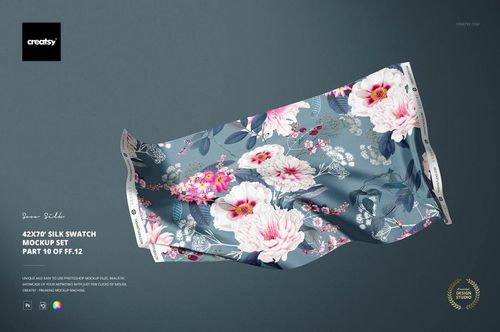 Silk fabric swatch mockup featuring a floral pattern with pink and white flowers on a blue background, front view.