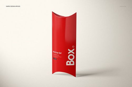 Front view of a red pillow box with white text, standing upright on a light background, packaging mockup.
