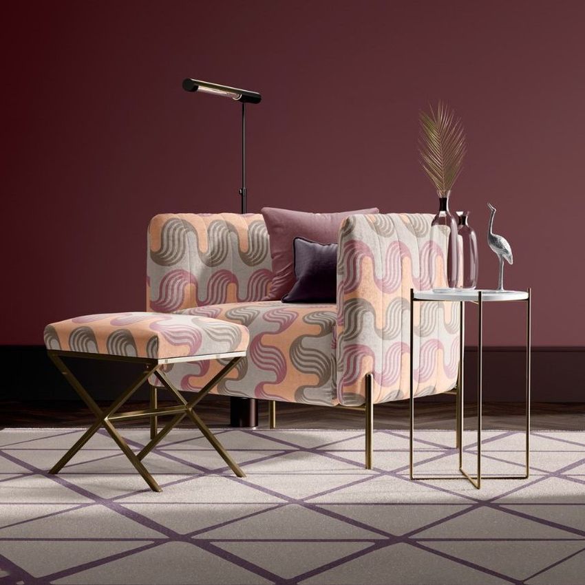 Armchair and stool mockup with pink and peach wavy pattern, set in a modern room with geometric rug and side table decor.