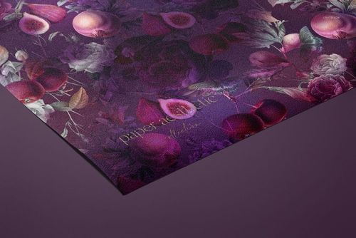 Close-up of a non-woven vinyl wallpaper mockup featuring a rich purple design with flowers and fruit motifs.