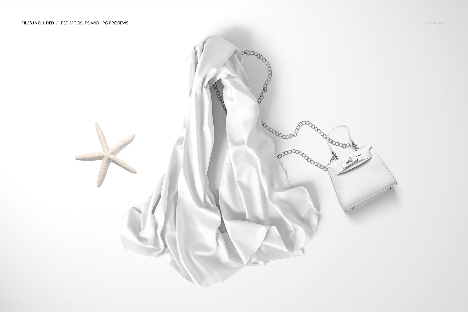 Chiffon silk scarf mockup laid out on a flat surface with a chain-strap purse and a starfish, viewed from above.
