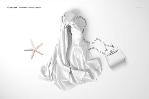 Chiffon silk scarf mockup laid out on a flat surface with a chain-strap purse and a starfish, viewed from above.