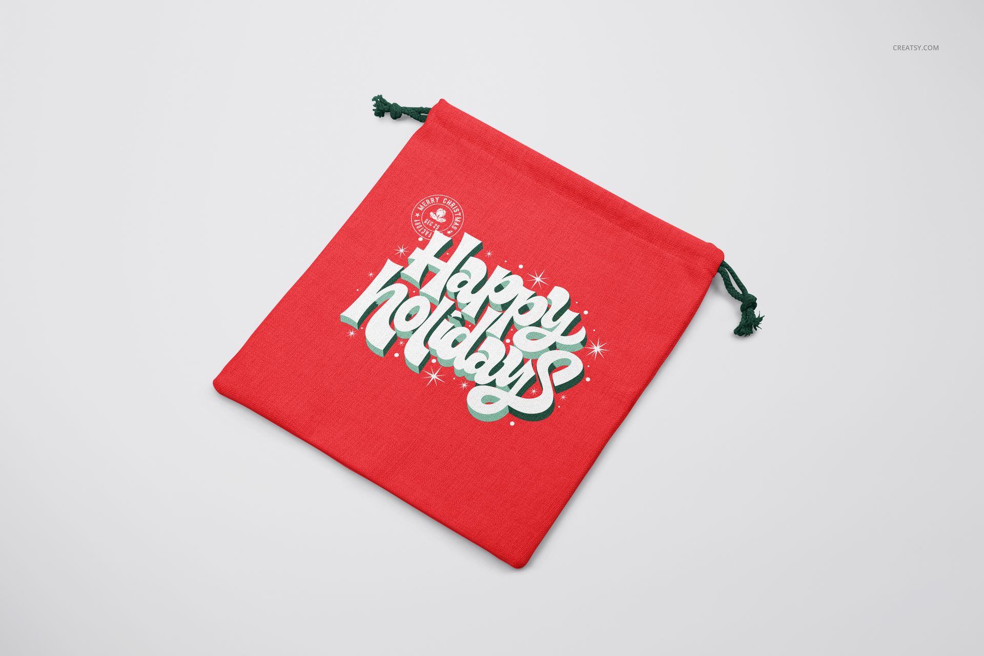 PSD mockup of a red Christmas sack with decorative holiday text, viewed from a top angle with drawstring detail.