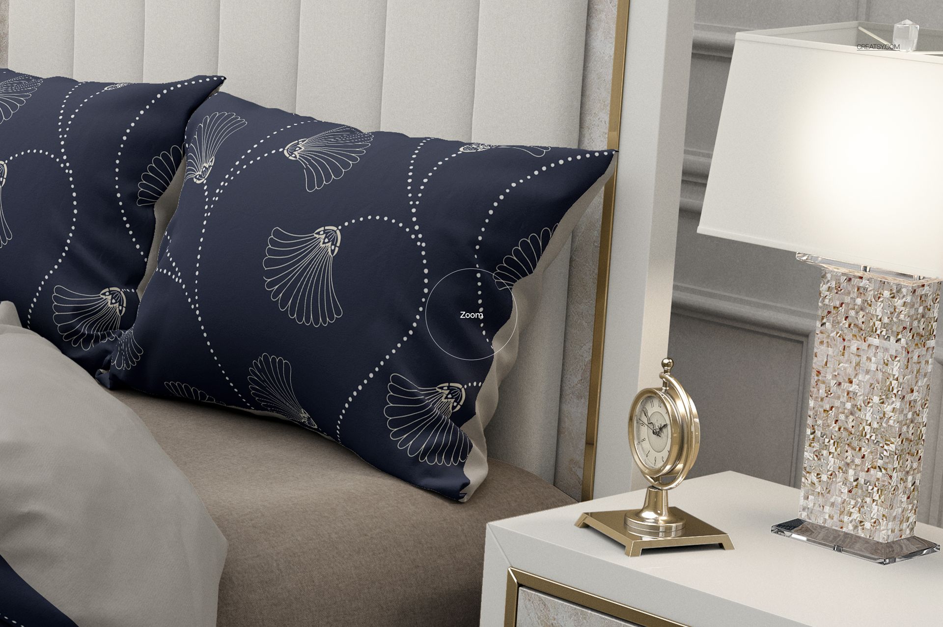 Close-up of a bedding mockup set showing navy pillows with white abstract designs, beige blanket, and elegant decor.