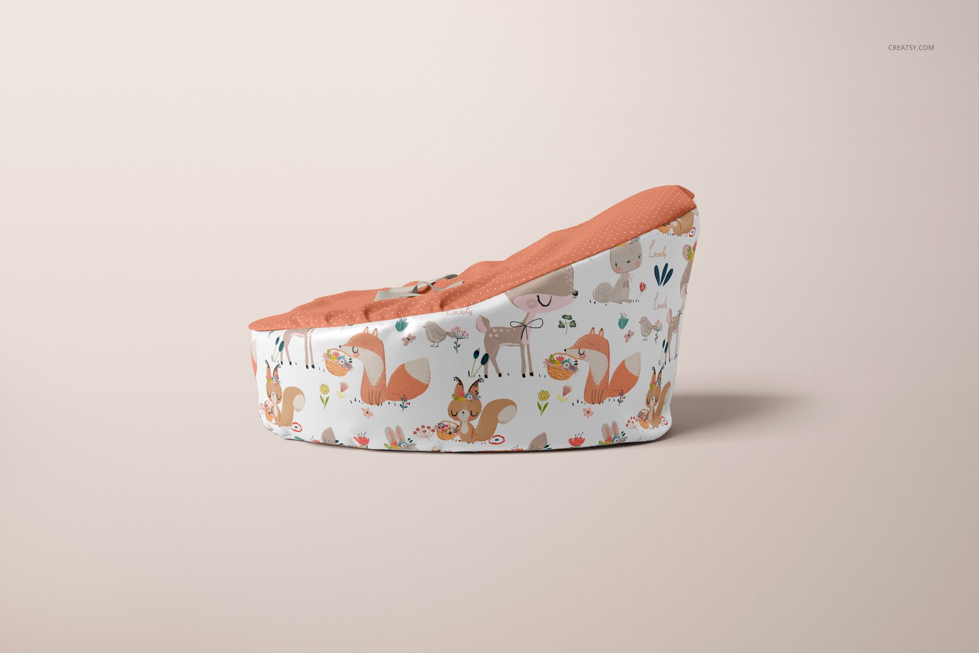 Side view of a baby bean bag mockup featuring an orange seat and playful forest animal print on a neutral backdrop.