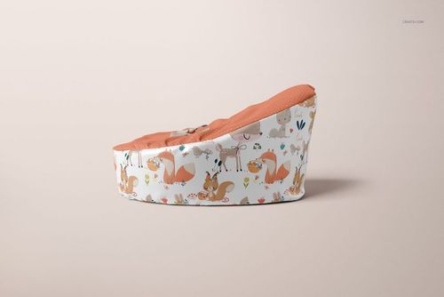 Side view of a baby bean bag mockup featuring an orange seat and playful forest animal print on a neutral backdrop.