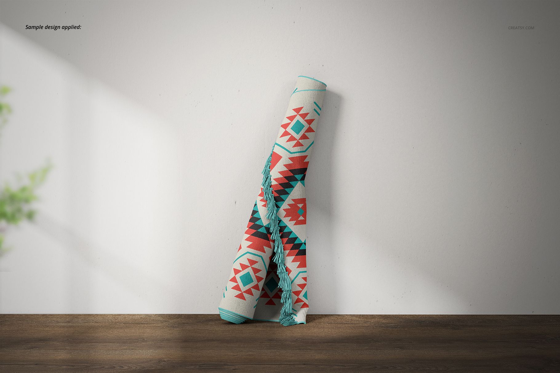 Fringed rug mockup featuring a colorful geometric design, shown rolled up on a wood surface with soft lighting.
