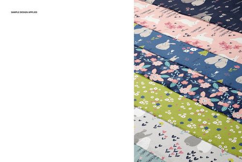 Fanned arrangement of patterned cotton fabric layers, featuring floral and animal designs, shown in a PSD mockup.