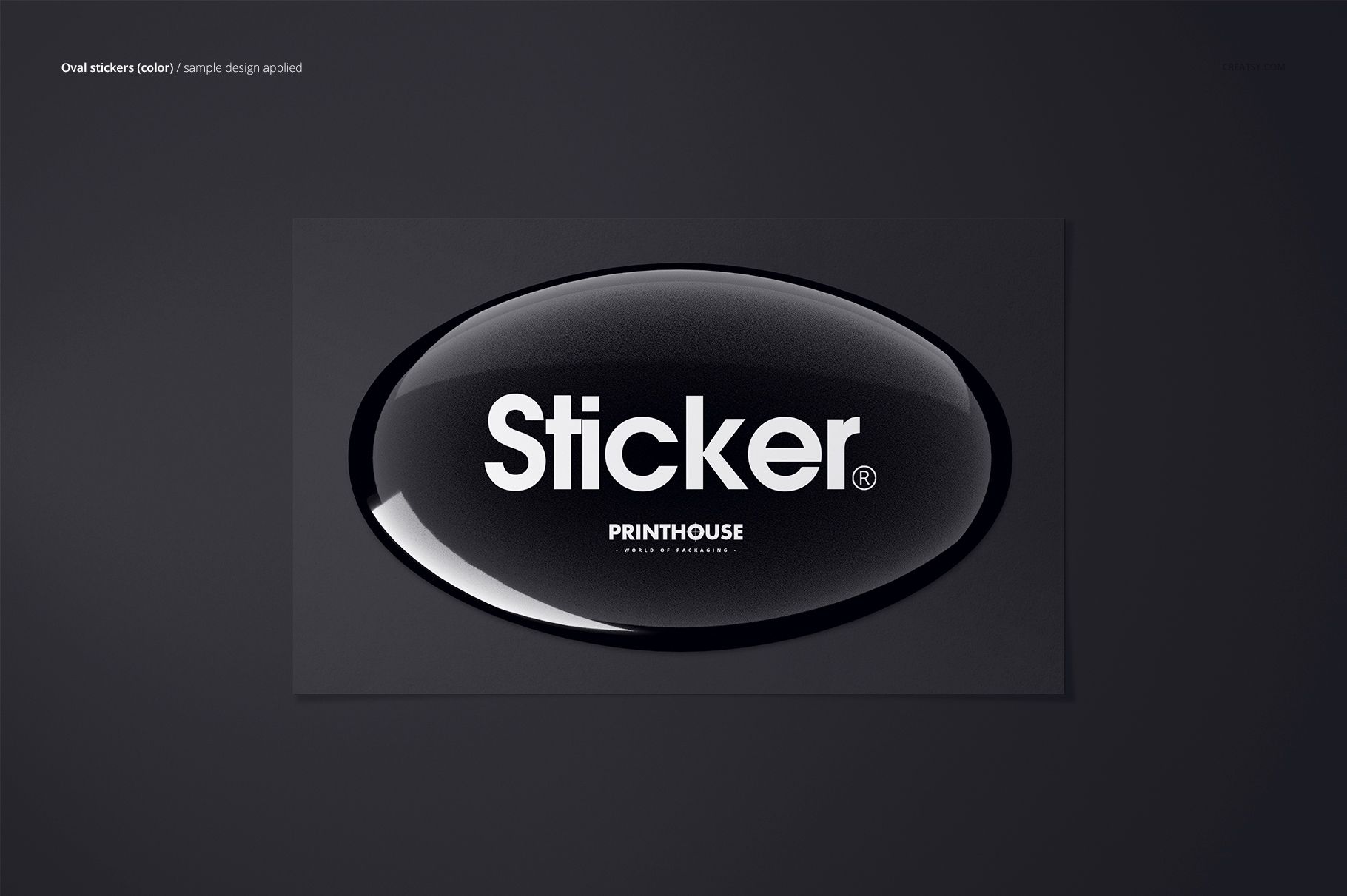Realistic PSD mockup of an oval epoxy dome sticker with reflective surface and white lettering, centered on gray.
