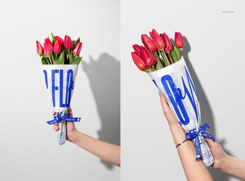 Red tulip bouquet in white and blue printed tissue wrapping, shown from a front and angled perspective in a mockup scene.