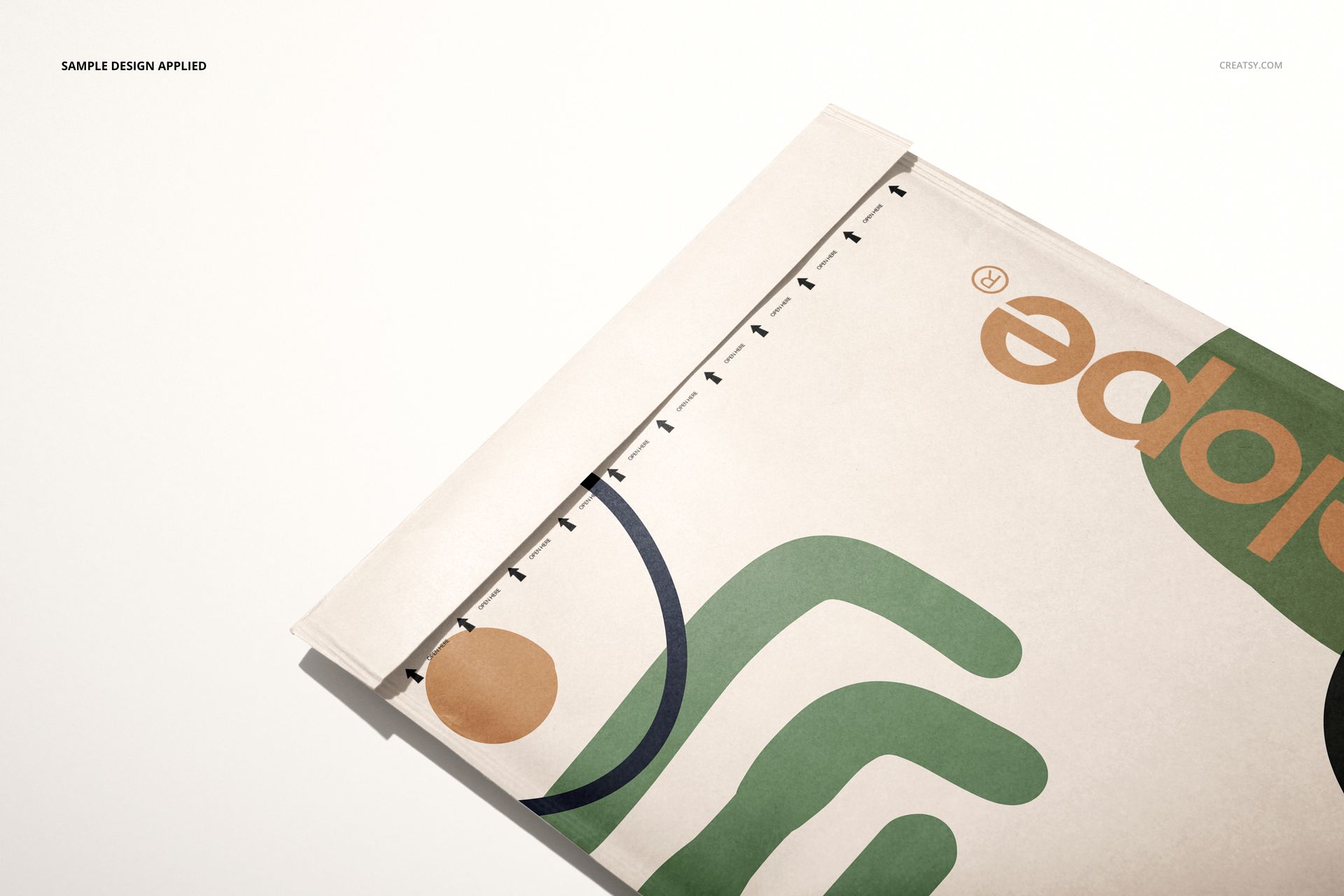 PSD mockup of a kraft bubble mailer featuring geometric design elements, displayed partially open on a white surface.