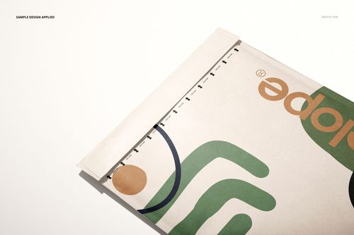 PSD mockup of a kraft bubble mailer featuring geometric design elements, displayed partially open on a white surface.