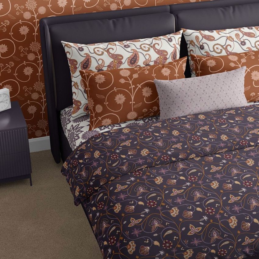 Bedding mockup featuring a bed with patterned sheets, pillowcases, and duvet cover in earthy tones and boho-inspired prints.