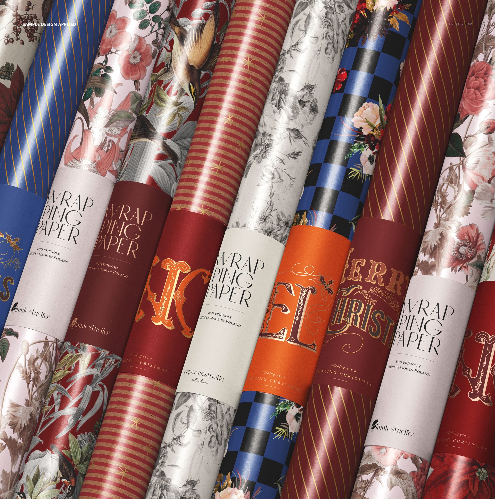 Group of Christmas wrapping paper rolls with various festive patterns and colors arranged in a close-up view.