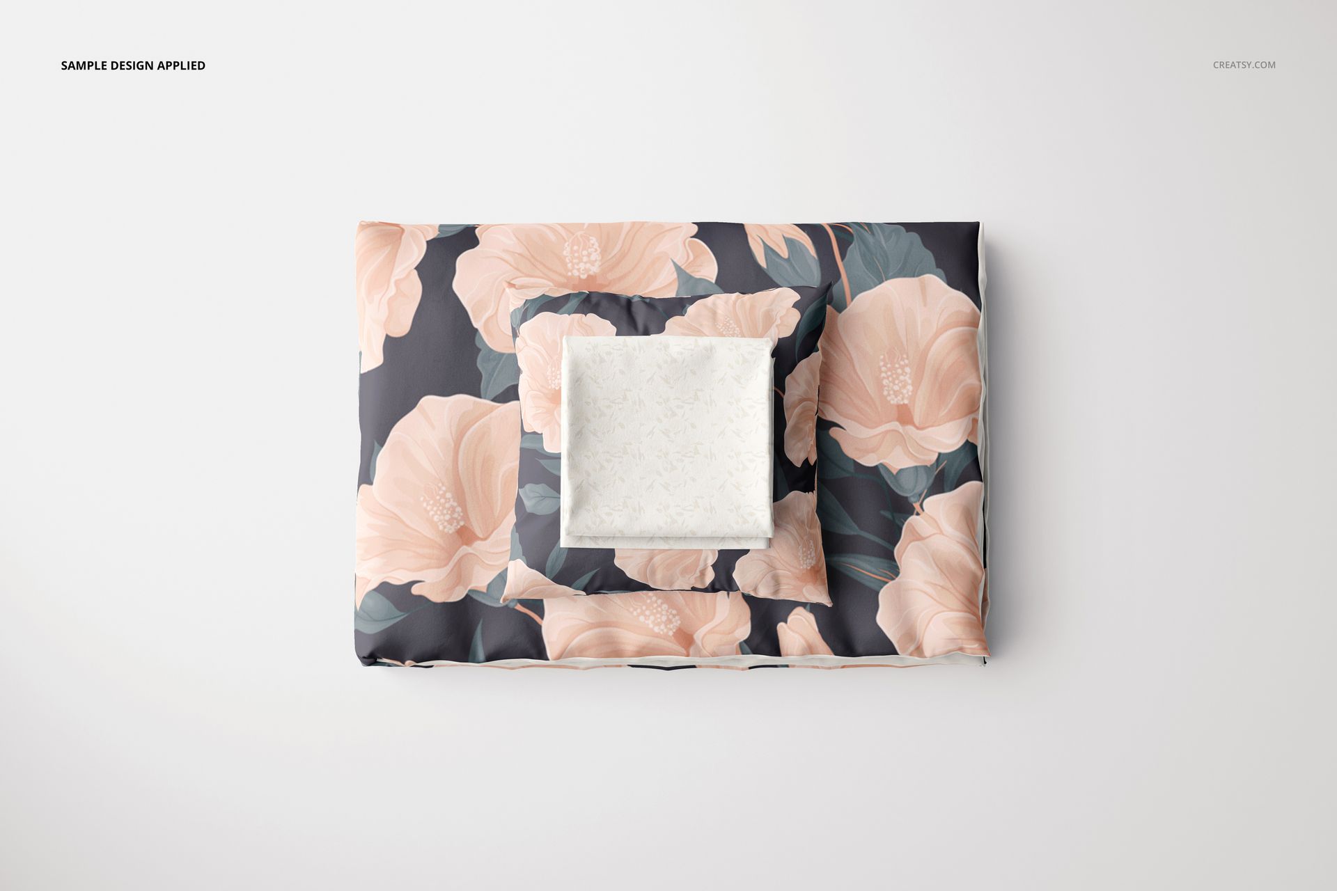 Flat lay of bedding mockup set with a Euro pillow, showing peach flower designs and a contrasting light pillow.