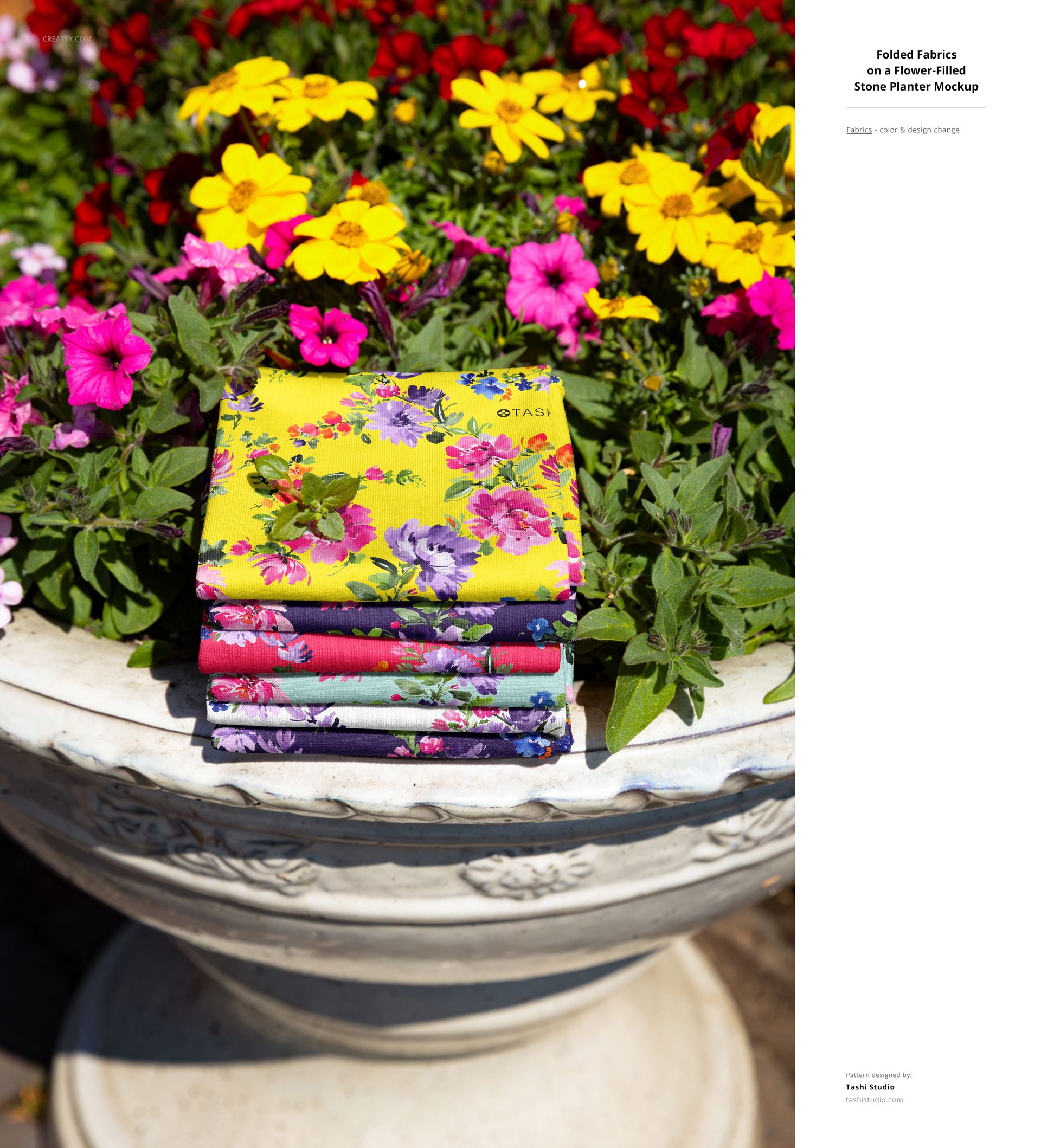 PSD mockup showing stacked patterned fabrics in various colors on a stone planter, set in an outdoor floral garden scene.