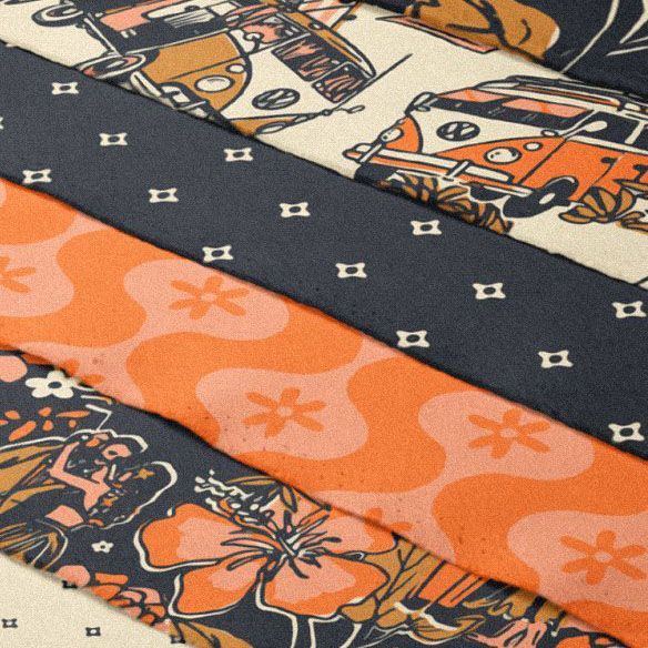 Fanned cotton fabric stack mockup showing several folded fabric pieces with retro patterns in orange, cream, and dark gray tones.