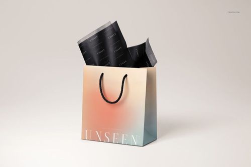 Mockup of a gift bag featuring a soft gradient, black rope handles, and black tissue paper with subtle text accents.