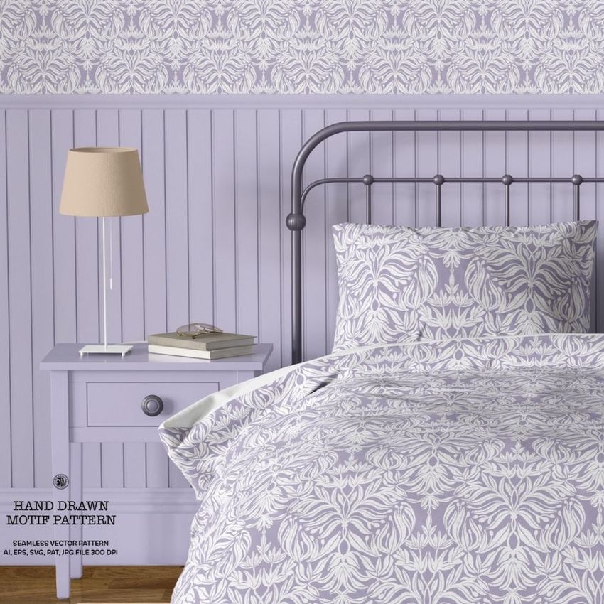 Vintage bedroom bedding mockup featuring a metal bed with patterned duvet and pillows, lavender tones, and a nightstand with a lamp.