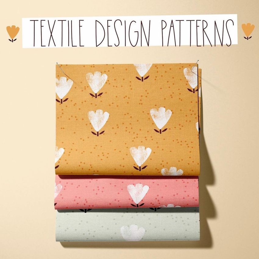 Fabric mockup featuring three folded fabric pieces with floral patterns in yellow, pink, and light gray on a beige background.