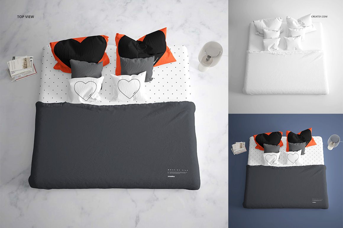 Top view of a bedding mockup set with dark gray duvet, heart-shaped pillows, and polka dot sheets on a marble floor.