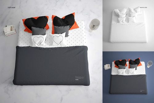 Top view of a bedding mockup set with dark gray duvet, heart-shaped pillows, and polka dot sheets on a marble floor.