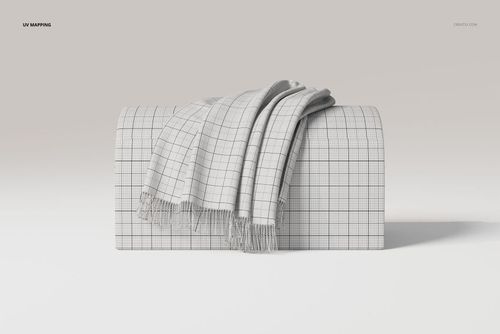 Draped throw blanket with a grid pattern displayed on a curved surface, shown from a front angle in a neutral setting.