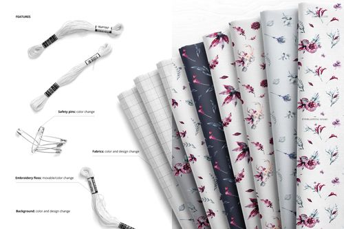 PSD mockup displaying folded textiles in soft colors and patterns, with removable embroidery floss and safety pins nearby.
