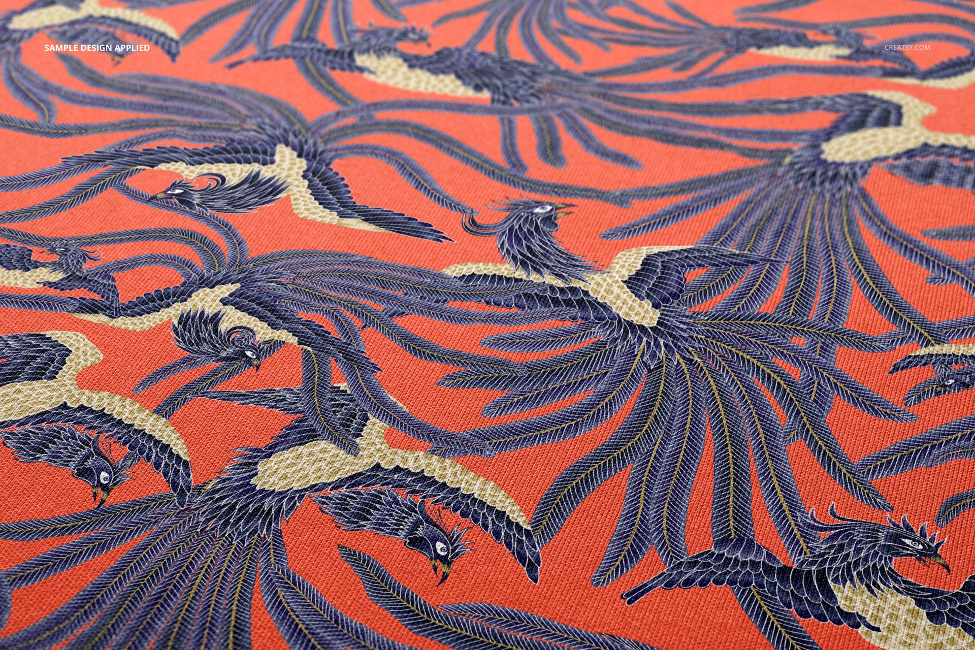 Scuba fabric mockup featuring a close-up view of blue and cream bird pattern on a vibrant orange textile surface.