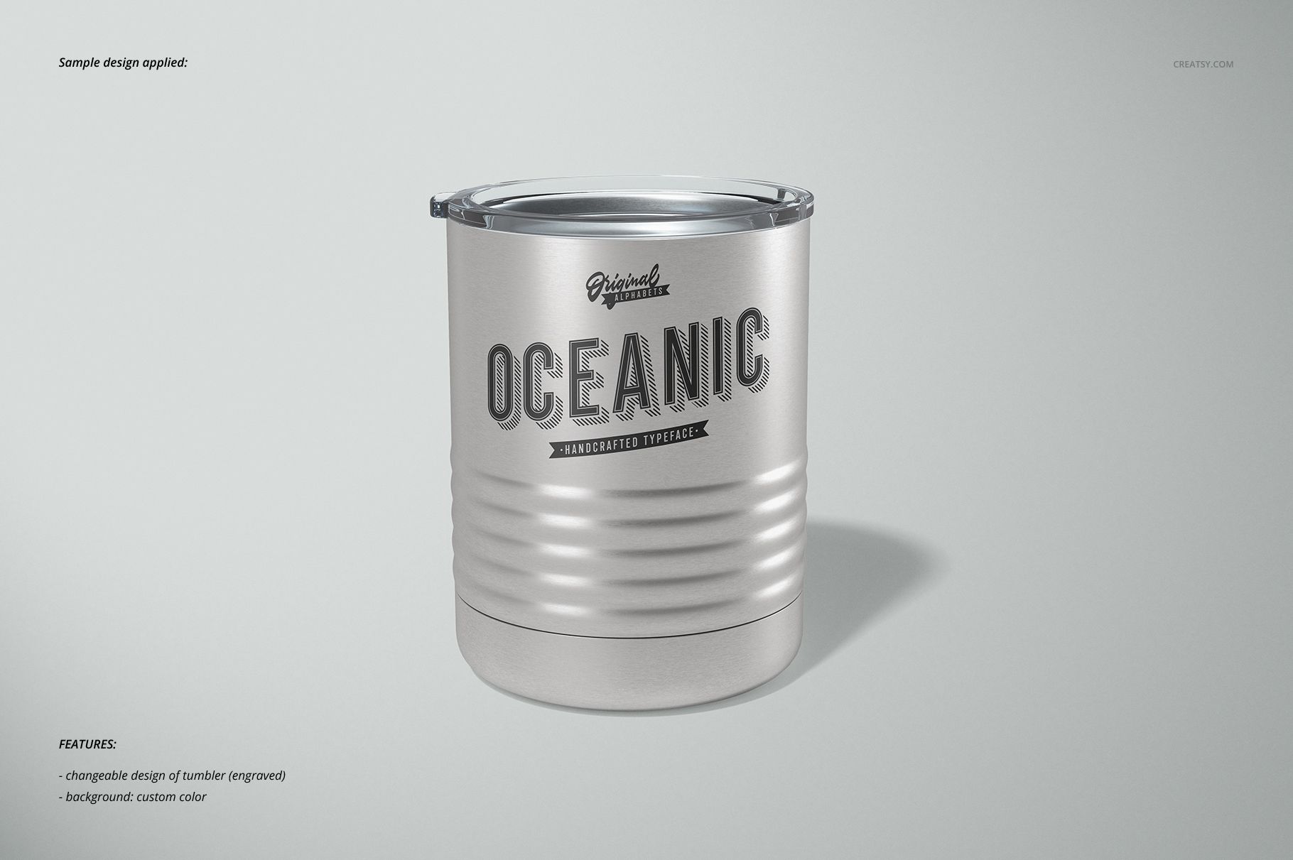 Front view of a 10 oz vacuum insulated tumbler mockup in silver, featuring an engraved oceanic design.