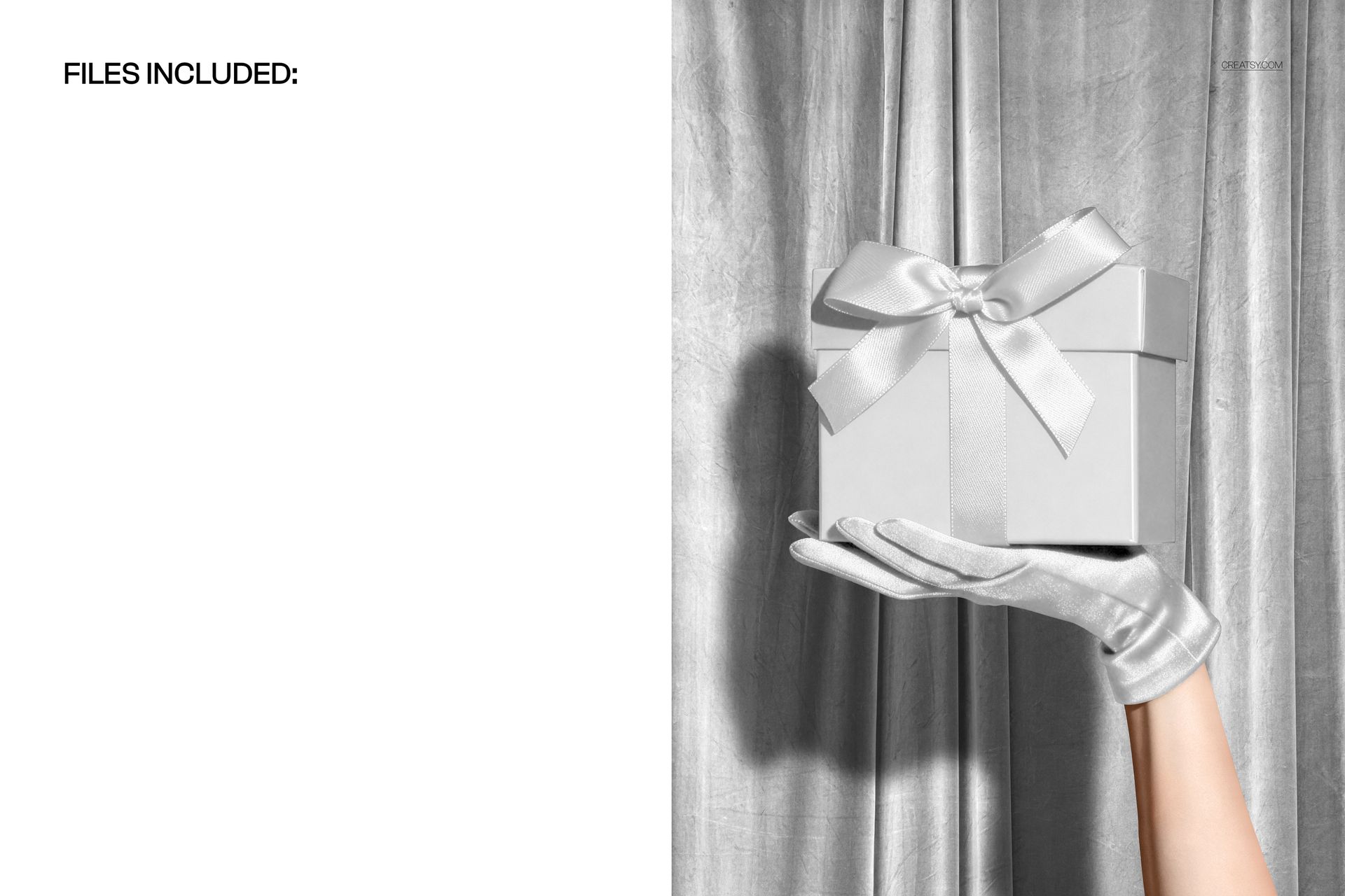 Christmas PSD mockup featuring a gloved hand displaying a wrapped present with a ribbon, silver curtain background.
