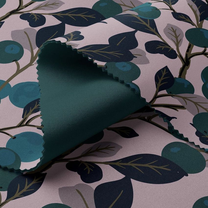 Scuba fabric mockup featuring a folded textile with a blue and green blueberry pattern on a pale background.
