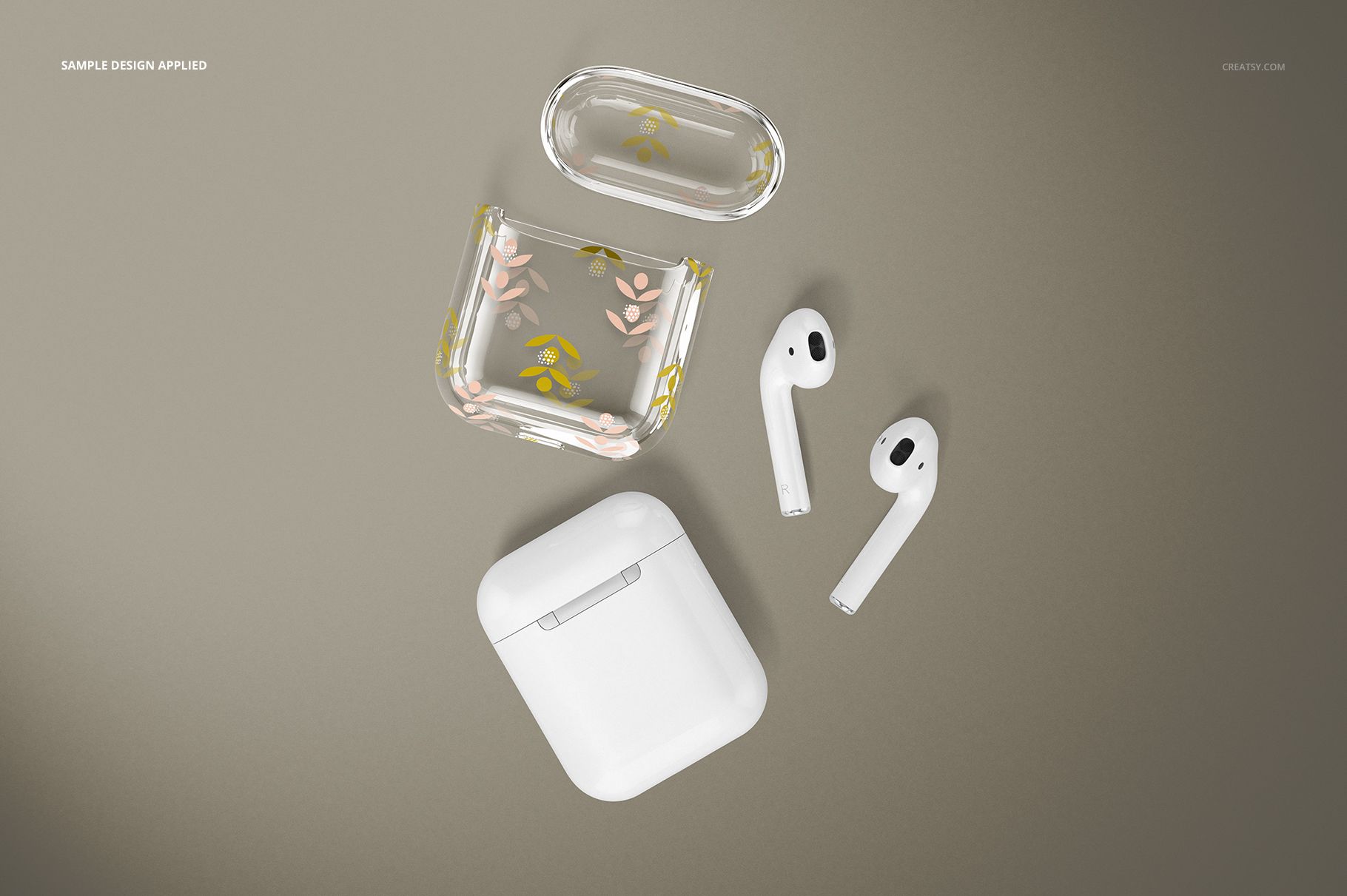 AirPods clear case mockup featuring floral artwork, open case parts, and wireless earbuds arranged on a beige surface.