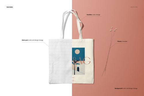 Front view of a tote bag mockup with white handles, split background in white and muted pink, and decorative dried plants.
