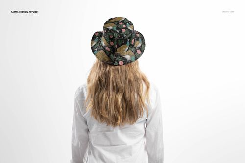 Reversible bucket hat mockup featuring a nature-inspired design, modeled by an adult facing away from the camera.