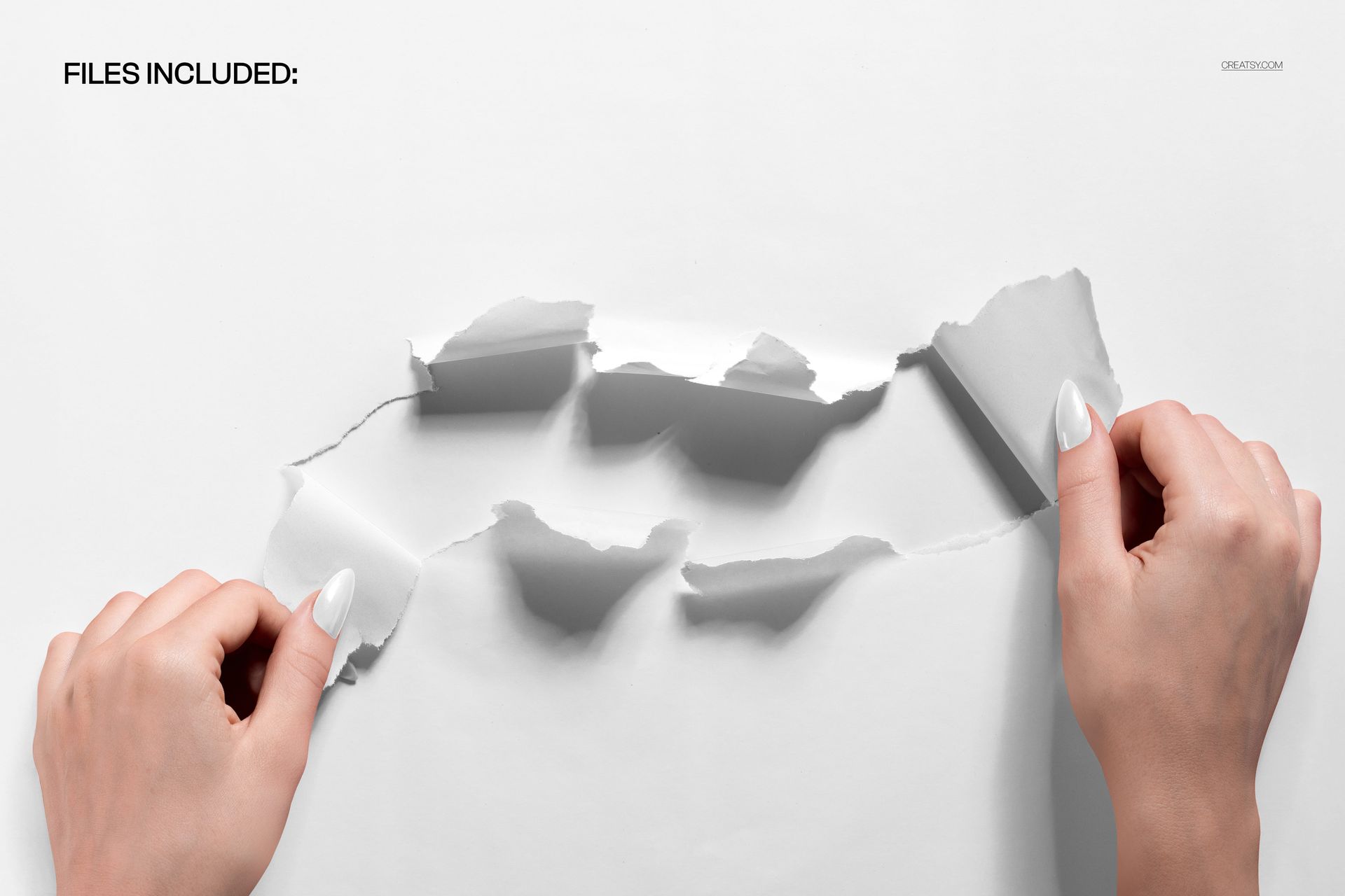 Close-up of two hands tearing white wrapping paper with jagged edges, showing a gift reveal concept for PSD mockup.