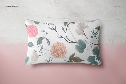 Top view of a 30x50cm piping pillow mockup featuring botanical prints in pastel colors on a light surface.