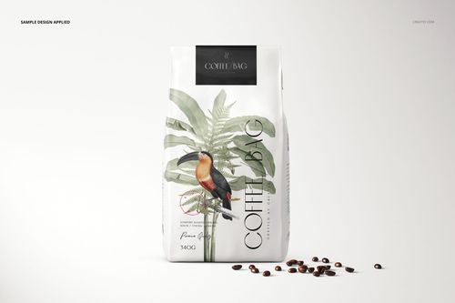 Paper coffee bag mockup featuring a toucan and palm design, shown upright with coffee beans on a plain background.