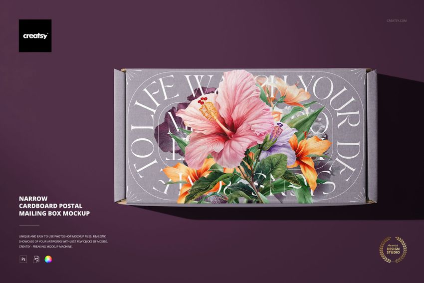 Narrow cardboard mailing box mockup with colorful floral design, viewed from above on a purple background.