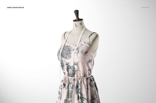 Fabric dress mockup displayed on a mannequin with a light pink and gray floral design, measuring tape over the shoulders.