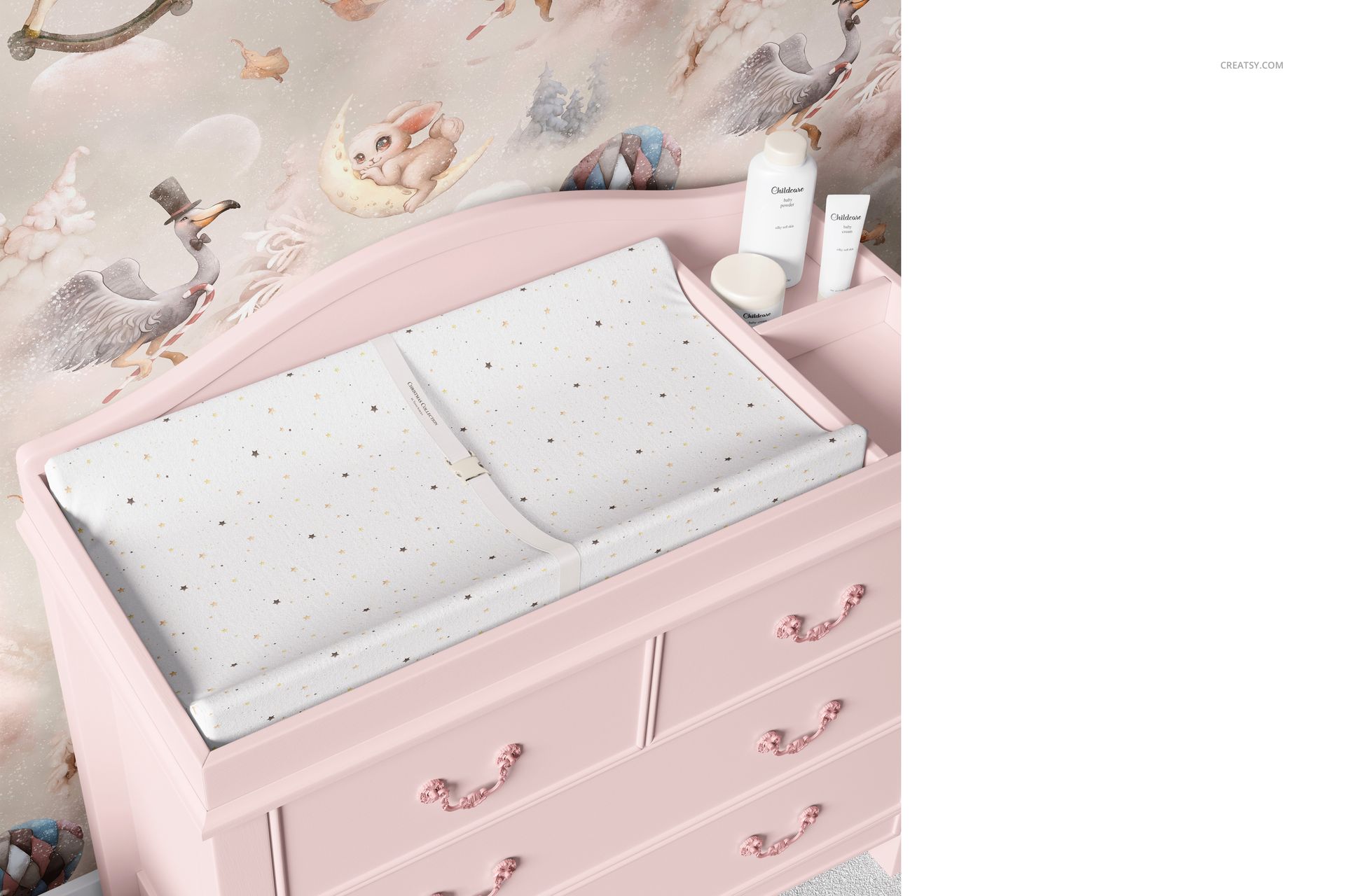 Baby room changing pad mockup featuring a white pad with small gold dots on a pastel pink dresser.