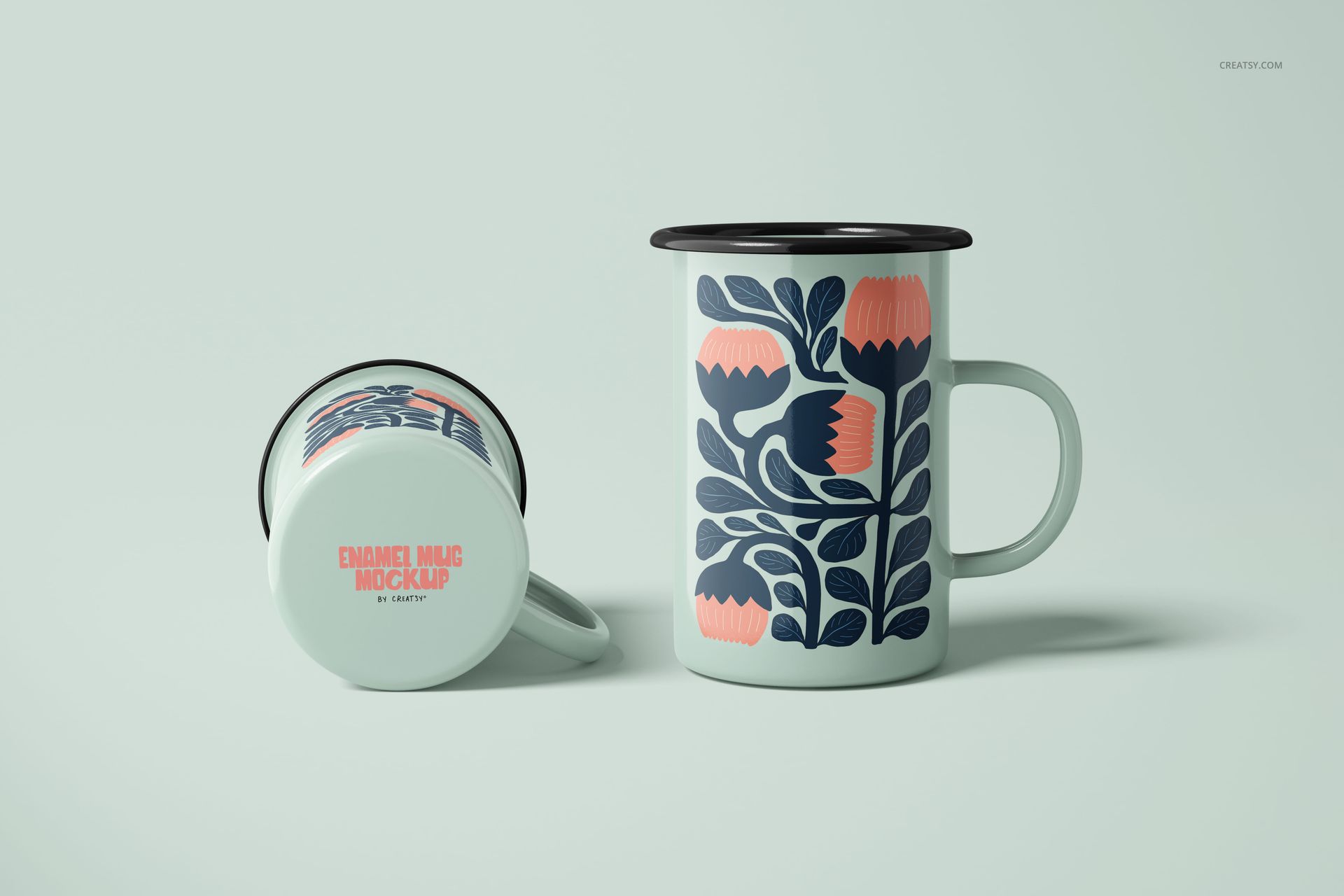 450ml enamel mugs featuring bold floral designs in dark blue and coral, displayed on a pale surface in a PSD mockup.