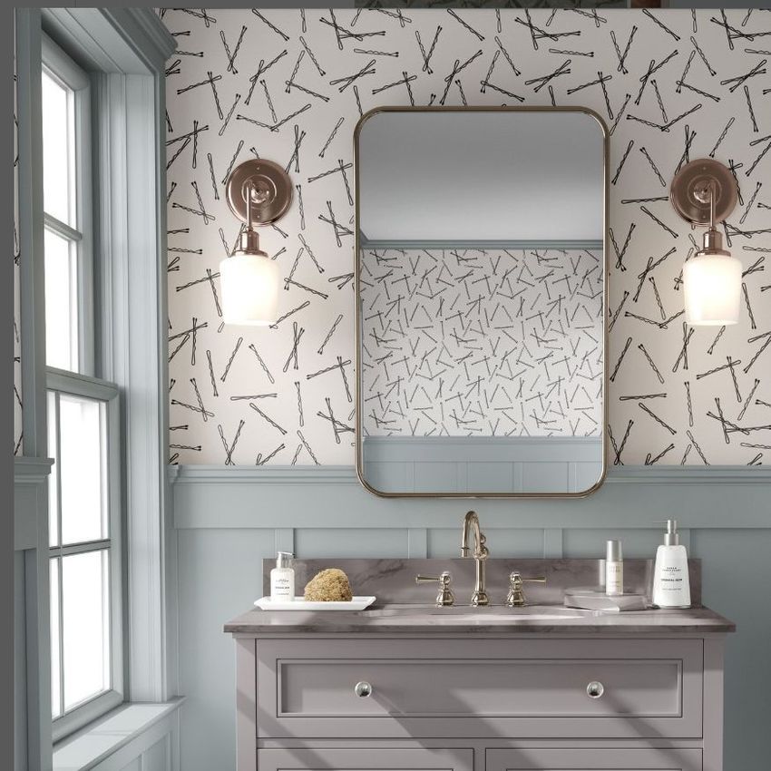 Bathroom mockup showing a vanity with a large mirror, wall-mounted lights, and patterned wallpaper with line art shapes.