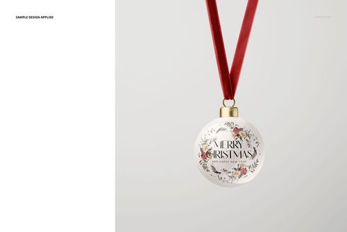 PSD mockup of handmade bone china bauble featuring festive floral design and gold holder, hanging from red ribbon.