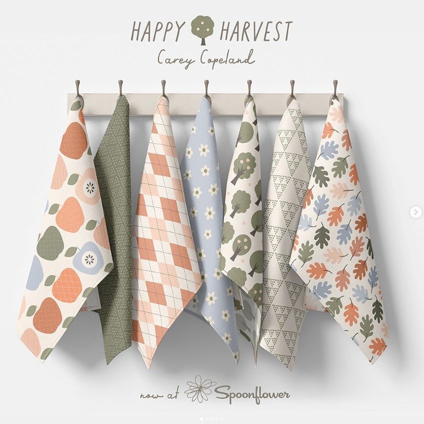 Hanging tea towels mockup featuring seven patterned towels on a wooden rack against a light background, with text above.